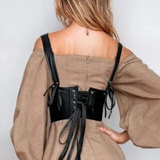 Back view of YesX Sexy Corset with adjustable lace-up design, highlighting its faux leather finish and supportive straps.